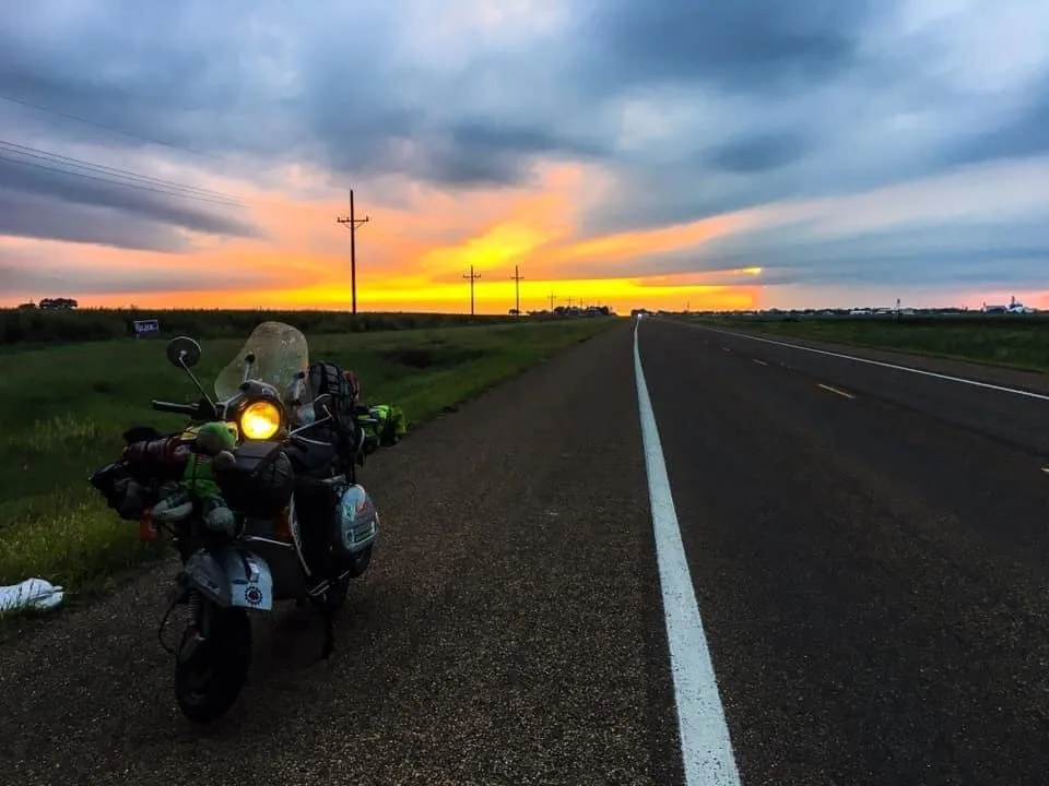 Vespa at sunset in Kansas after tornado during world circumnavigation 2018