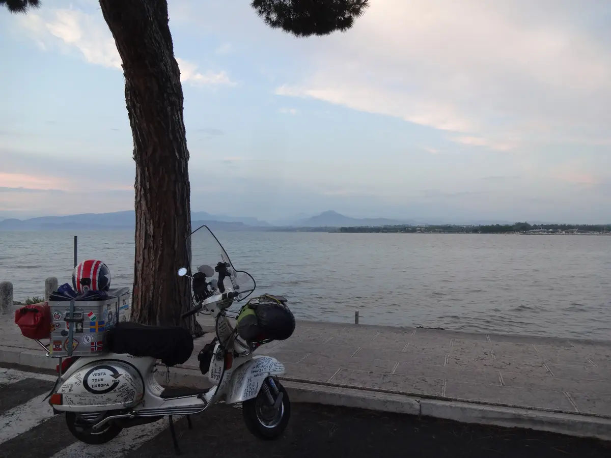 Madalina the Vespa P200E at Lago di Garda at sunset — on the way to Spain 2015