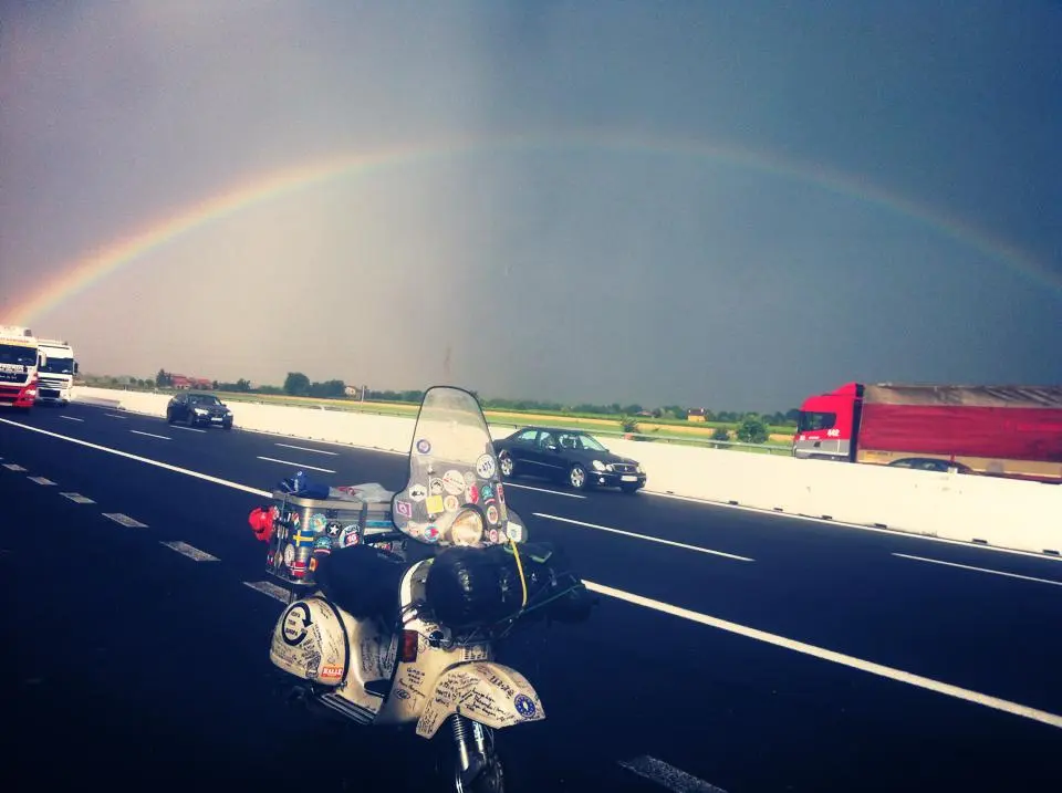 Madalina the Vespa P200E under a rainbow on the highway — Croatia/Slovenia border 2015