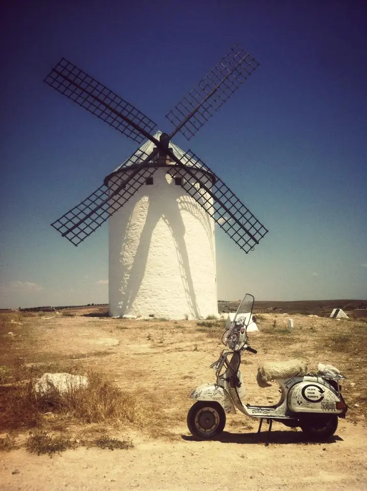 Madalina the Vespa P200E in front of a windmill in La Mancha — Mission Quijote 2015
