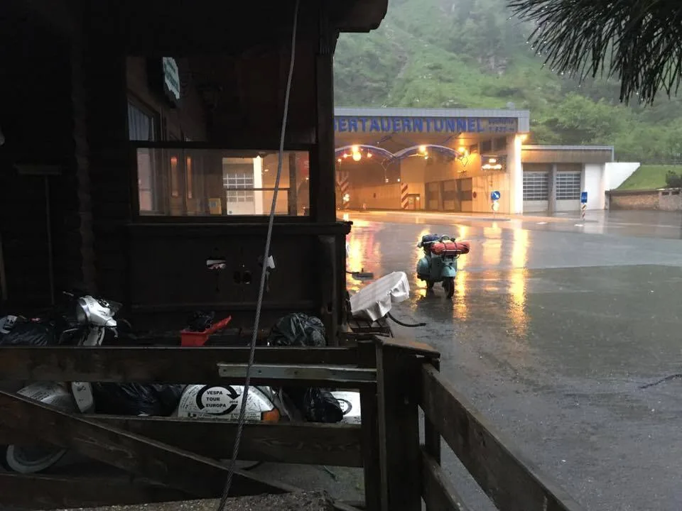 Madalina parked outside Felbertauern tunnel exit in heavy rain Austria 2016 — roadside repair after carburettor failure