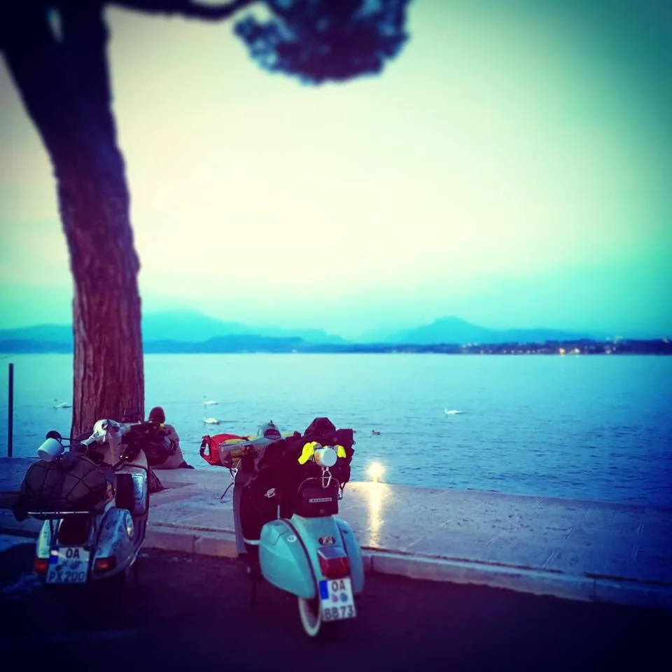 Madalina and Rosinante parked at Lago di Garda at dusk on the way to Vespa Alp Days Zell am See 2016