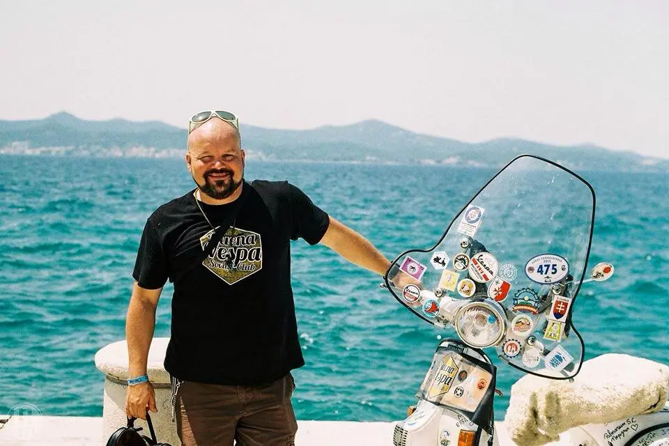 Markus Mayer with Madalina at the harbour in Biograd na Moru — Vespa World Days 2015
