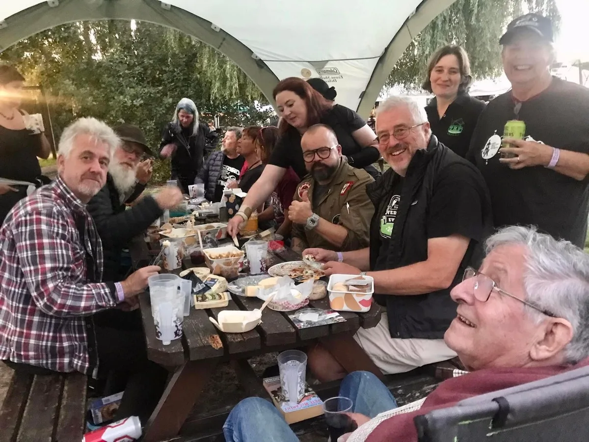 Markus André Mayer dining with Ted Simon and adventure riders at Overland Event Oxford 2023