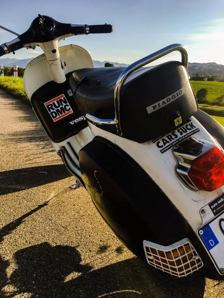 Vespa with Run DMC and Cars Suck stickers in the Allgäu — oldschool scooter culture Kempten