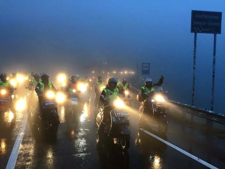 Almost 50 Vespas crossing the Jaufenpass Passo Giovo at 2,094 metres in fog and rain at night — PreRe Vespa night rally Austria 2015